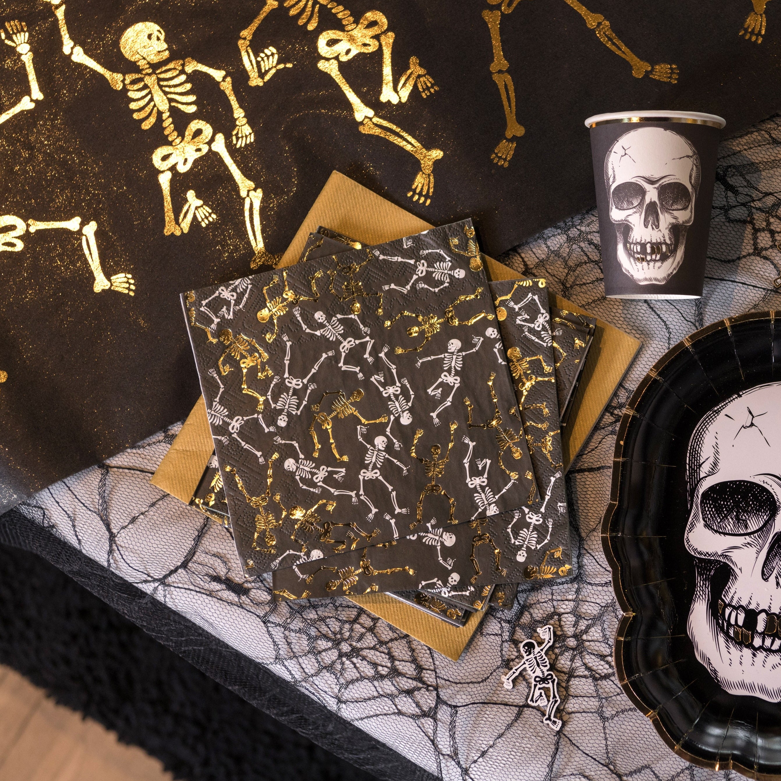 Guld/hvide skelet servietter, 10 stk.