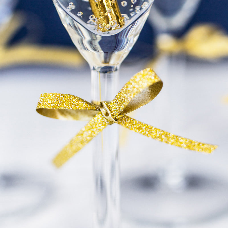 Guld glitter sløjfe på stilk